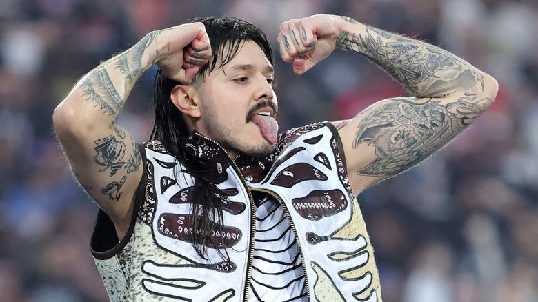 Dirty Dom flexing on 'em with his tongue out