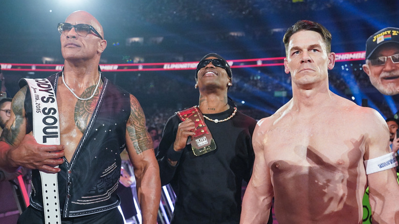 The Rock, Travis Scott, and John Cena at Elimination Chamber
