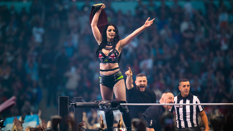 saraya celebrating on turnbuckle