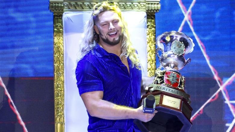 lexis king holding the heritage cup