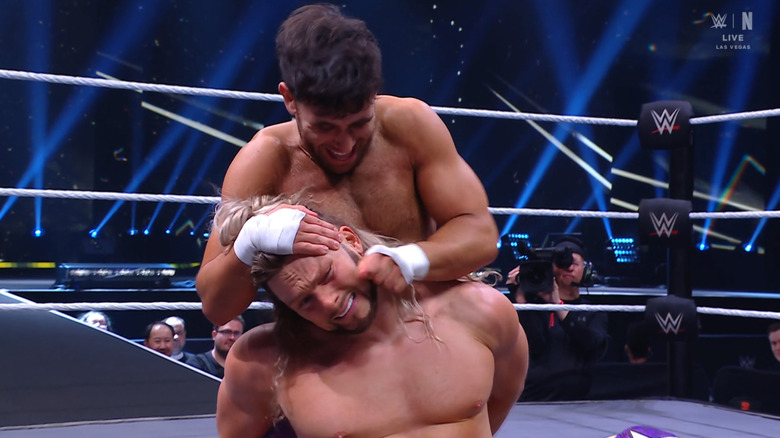 Dar with a submission locked in on King