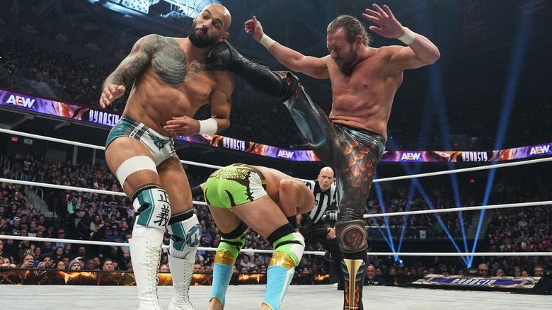 Ricochet eats kick from Kenny Omega during their match with Speedball Mike Bailey at AEW Dynasty